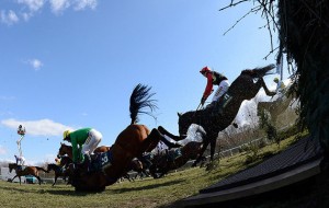 Competitors jump Beechers Brook